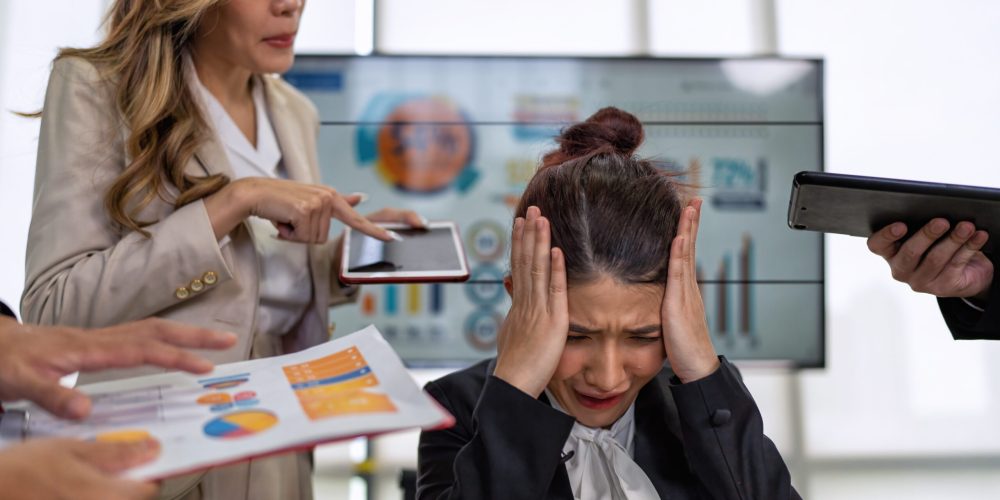 Stressed overwhelmed business worker feels tired at work overload exhausted suffering from headache